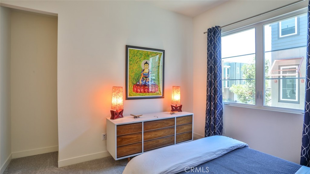 Secondary bedroom with walk-in closet and next to full hall bathroom. - 1207 Doheny Way, Dana Point CA 92629 - photo 30