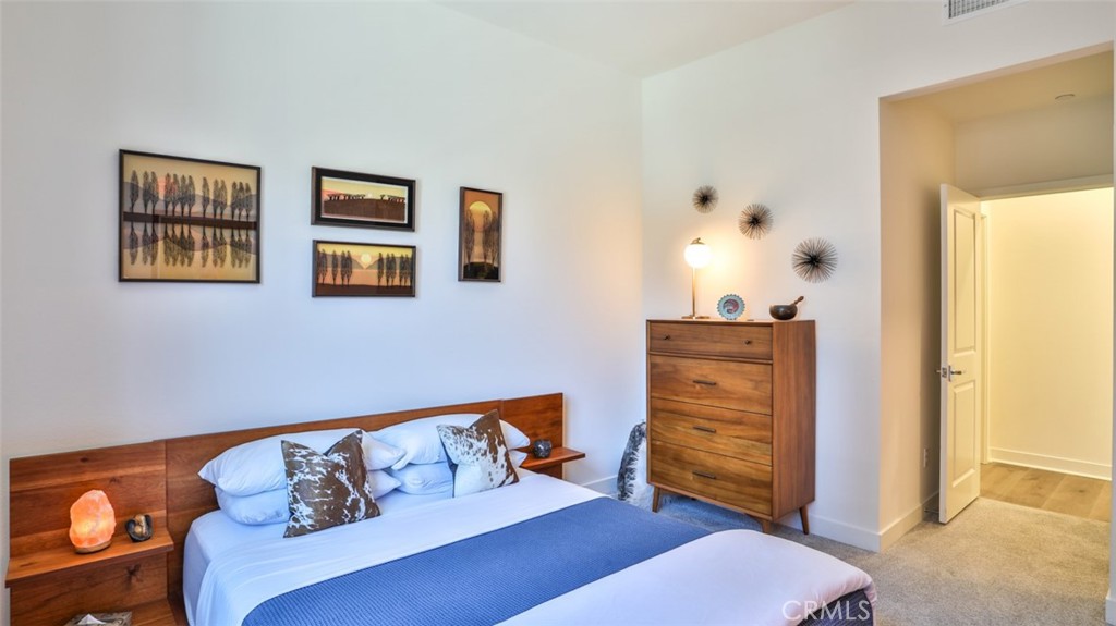 Secondary bedroom with walk-in closet and next to full hall bathroom. - 1207 Doheny Way, Dana Point CA 92629 - photo 31