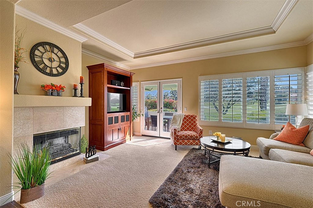 Lovely living room with fantastic view of the fairways. Enjoy the ocean breeze through the French Doors that lead to the - 14 Forest Hills Ct. #51, Dana Point CA 92629 - photo 1