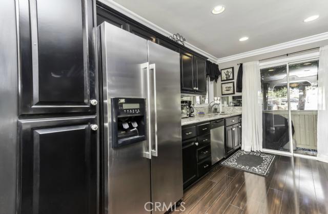 Upgraded kitchen with stainless steel appliances, beautiful granite countertops and upgraded cabinetry - 16 Corniche Drive D, Dana Point CA 92629 - photo 1