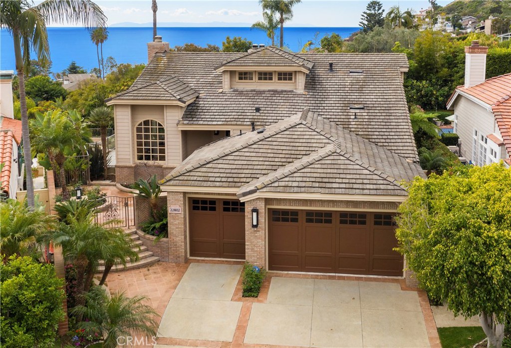 Beautiful custom home located in a gated community of Emerald ridge. The home is located at the end of a cul-de sac, pri - 22802 Via Orvieto, Dana Point CA 92629 - photo 1