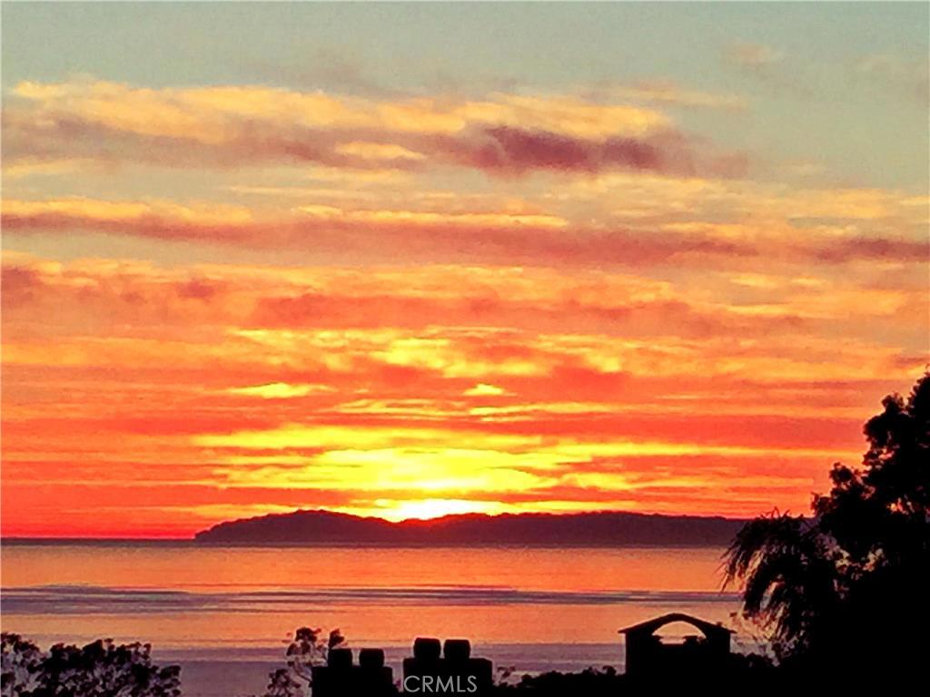 Imagine sitting on your private balcony, with a glass of wine and good conversation--watching the sun set over Catalina - 23281 Pompeii Drive, Dana Point CA 92629 - photo 1