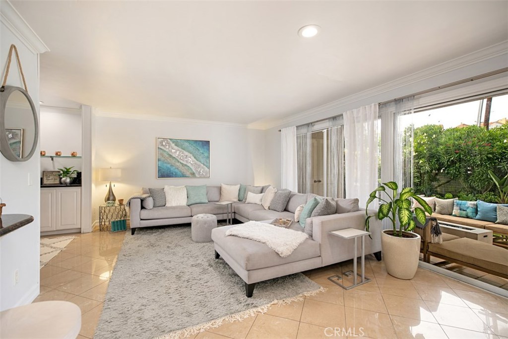 Open floor plan living room, den, and back yard patio - 24242 Santa Clara Avenue 33, Dana Point CA 92629 - photo 1