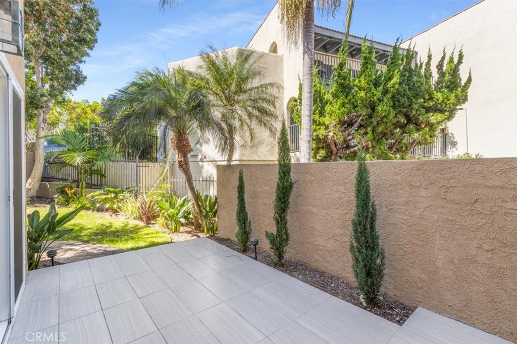 TILED PATIO LEADS TO GRASSY BACKYARD... - 24345 Vista Point, Dana Point CA 92629 - photo 20