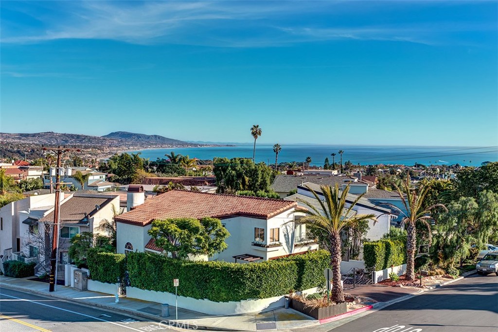 This is the view from the master bedroom. After the sun sets, the city lights of Dana Point, San Clemente and beyond are - 24396 Vista Point Lane, Dana Point CA 92629 - photo 1