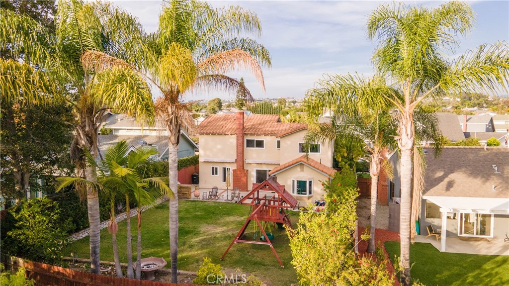 Lush palm trees tower over your huge private backyard with no neighbors behind you. - 24412 Caracas Street, Dana Point CA 92629 - photo 1