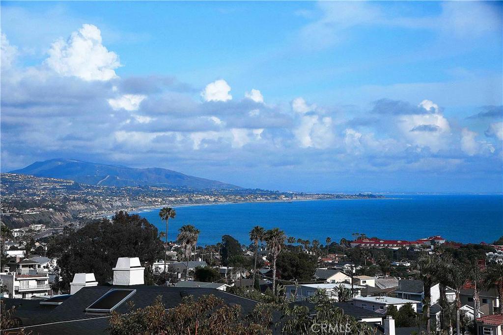 This is a photo of the view from the Living Room, and the Living Room deck from THE FIRST LEVEL of the house. That's rig - 24450 Alta Vista Drive 2, Dana Point CA 92629 - photo 1