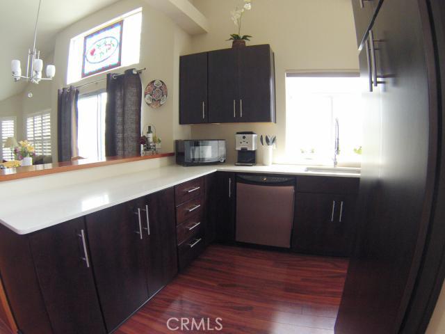 Remodeled Kitchen, with deep stainless steel sink, Silestone counters, Cherry cabinets. Refrigerator included - 24451 Lantern Hill Drive F, Dana Point CA 92629 - photo 1