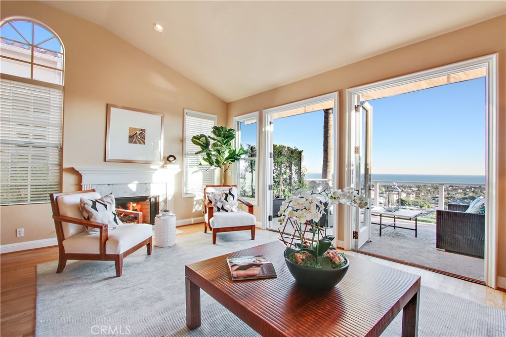 Gorgeous interiors of this open floor plan villa with two sets of french doors open to huge deck. - 24484 Alta Vista Drive, Dana Point CA 92629 - photo 1