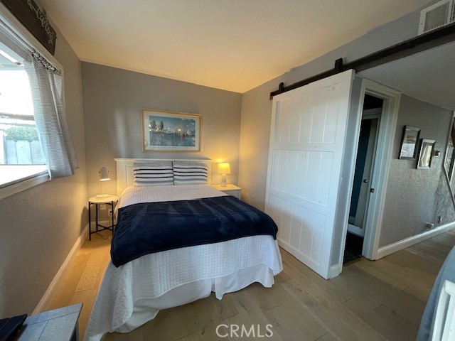 Main living area bonus room has double bed, includes glass slider to backyard. - 24561 D Harbor View Drive 13, Dana Point CA 92629 - photo 11