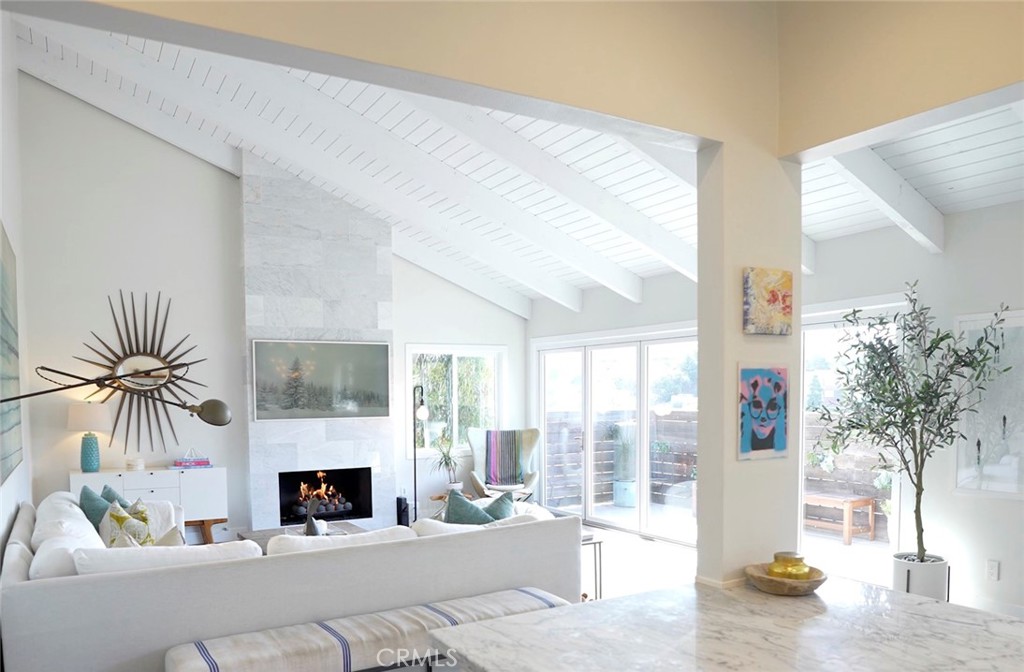 Very stylish Fireplace, open and airy room with wood flooring. - 25222 Manzanita Drive, Dana Point CA 92629 - photo 1