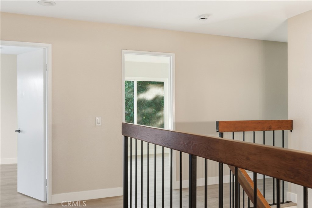 View of Stairs and Second Bedrooms from Primary Bedroom. (3 second bedrooms total). - 25302 Neptune Drive, Dana Point CA 92629 - photo 15