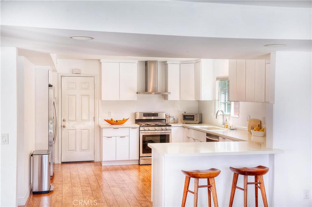All new custom contemporary kitchen with caesarstone counters and backsplash. Self closing drawers. Stainless appliances - 25321 Mainsail Drive, Dana Point CA 92629 - photo 1