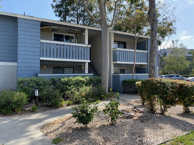 Upstairs end unit on the right. - 25611 Quail Run 128, Dana Point CA 92629 - photo 1