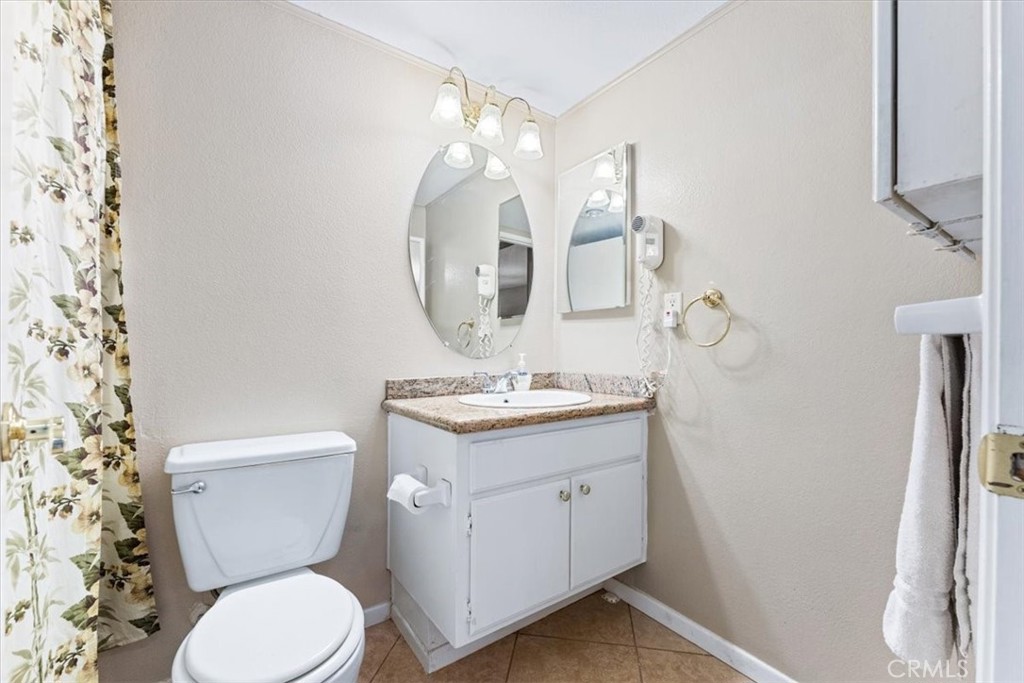 Primary full bath has the shower in tub. - 25611 Quail Run 32, Dana Point CA 92629 - photo 19