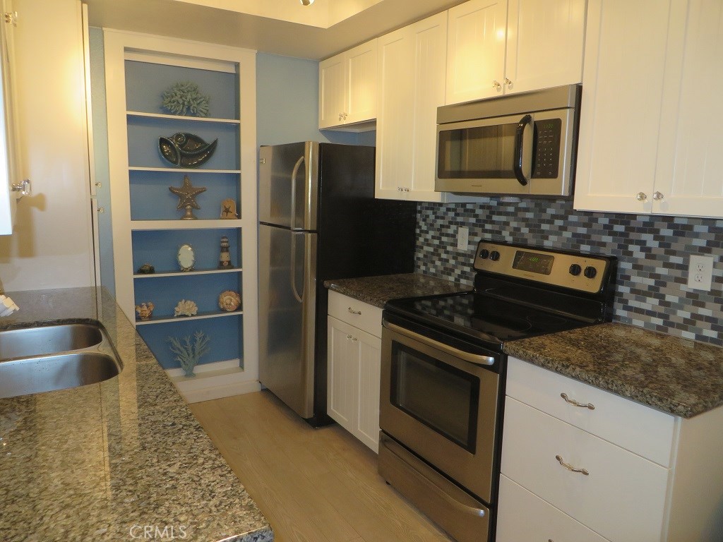 Remodeled Kitchen with Granite Counters and SS Appliances - 25611 Quail Run 98, Dana Point CA 92629 - photo 1