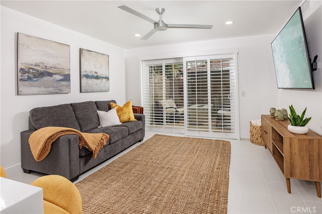 Family Room that Leads to Outdoor Firepit - 25656 Fishermans Drive 221, Dana Point CA 92629 - photo 11
