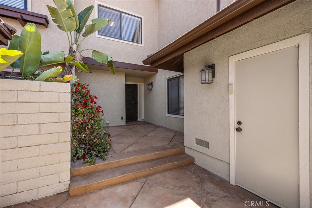 Garage side door leads to large front patio & porch - 25716 Harbor Point Dr. 178, Dana Point CA 92629 - photo 2