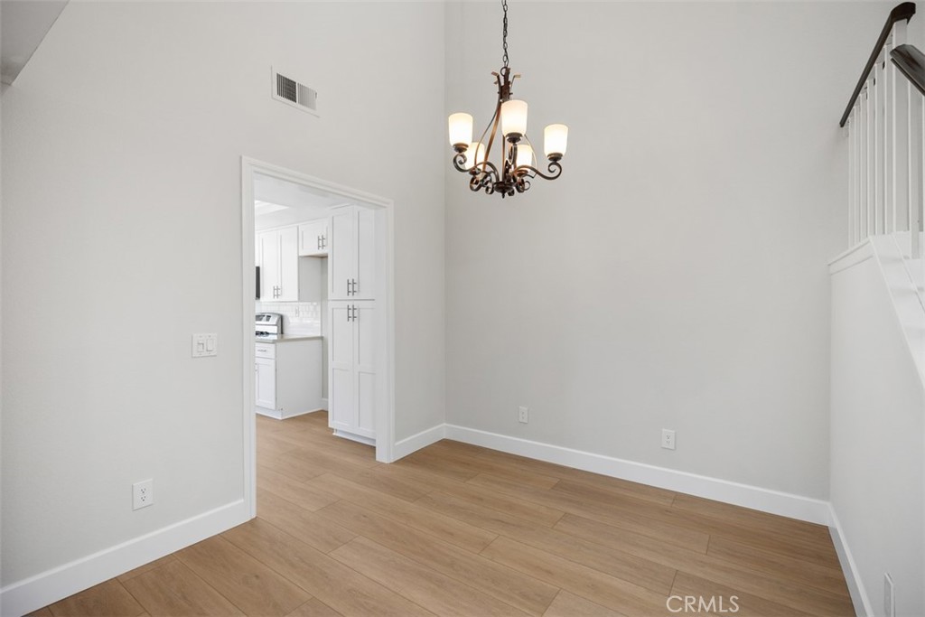 Vaulted ceiling above the dining area gives an open feeling. New vinyl flooring & freshly pained walls and floor trim. - 25716 Harbor Point Dr. 178, Dana Point CA 92629 - photo 5