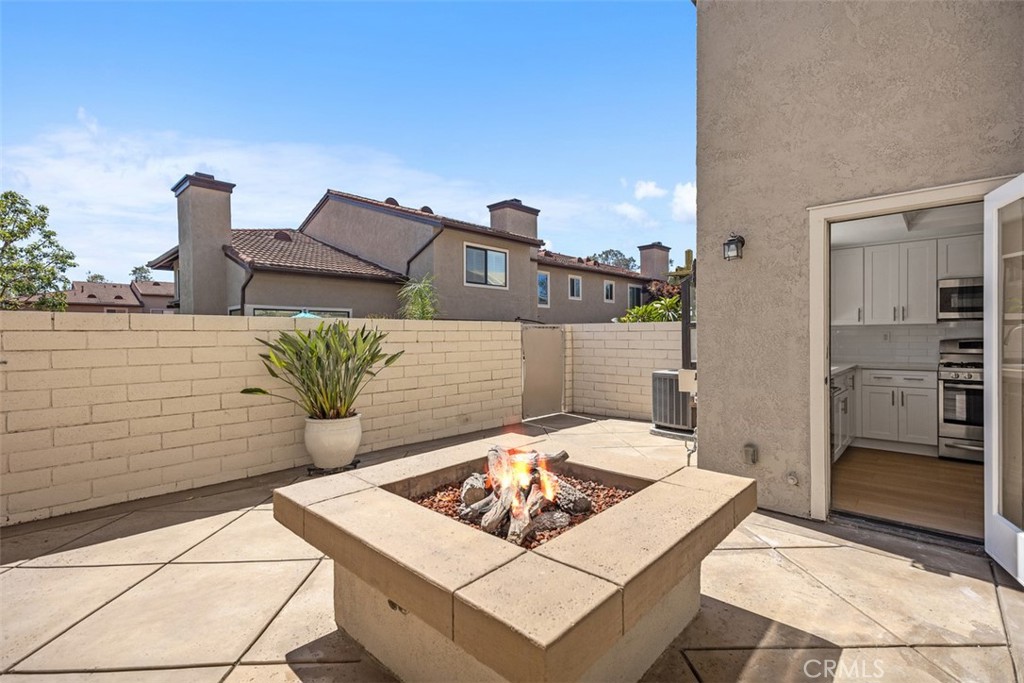 Access the large patio directly from the kitchen or living room sliding glass door. - 25716 Harbor Point Dr. 178, Dana Point CA 92629 - photo 7