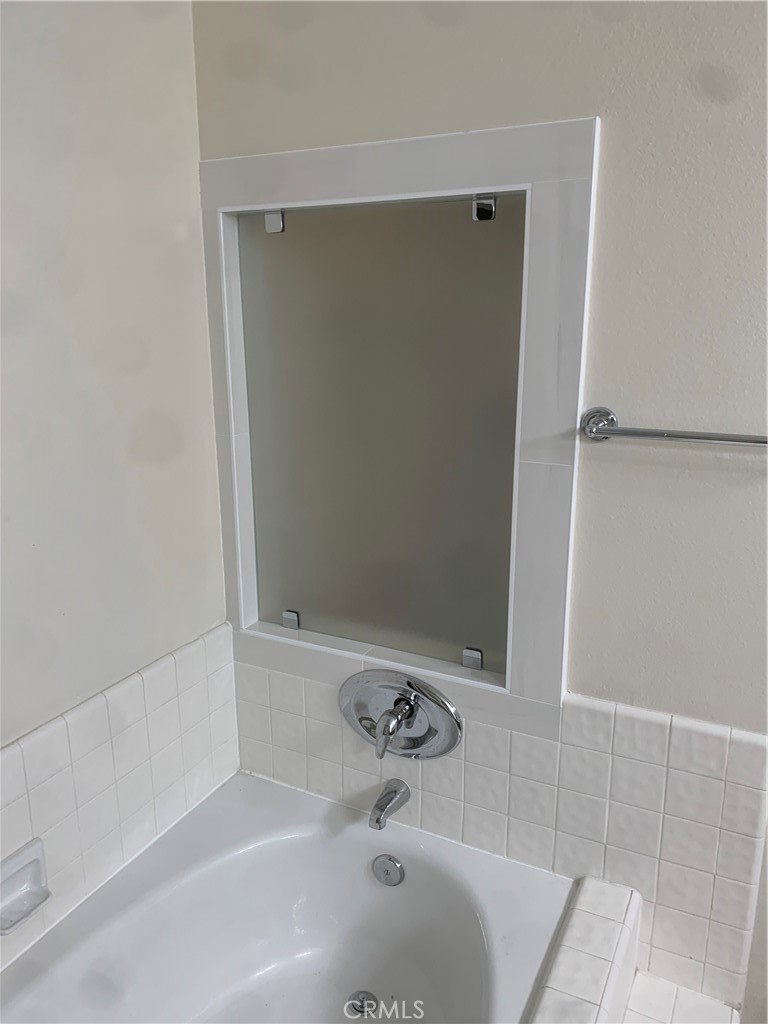 Primary bathroom tub, with shower and toilet in separate room. - 25716 Harbor Point Dr. 178, Dana Point CA 92629 - photo 13