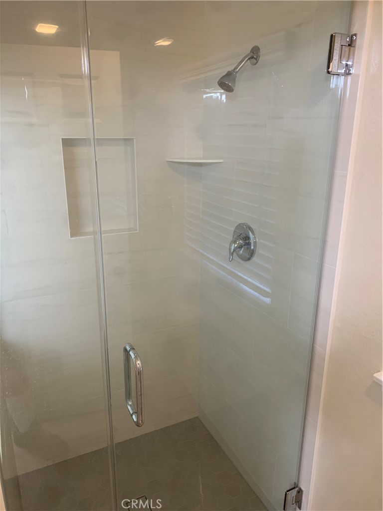 Primary bedroom shower was recently completely remodeled. Shower and toilet are in a separate room next to primary BR tu - 25716 Harbor Point Dr. 178, Dana Point CA 92629 - photo 16