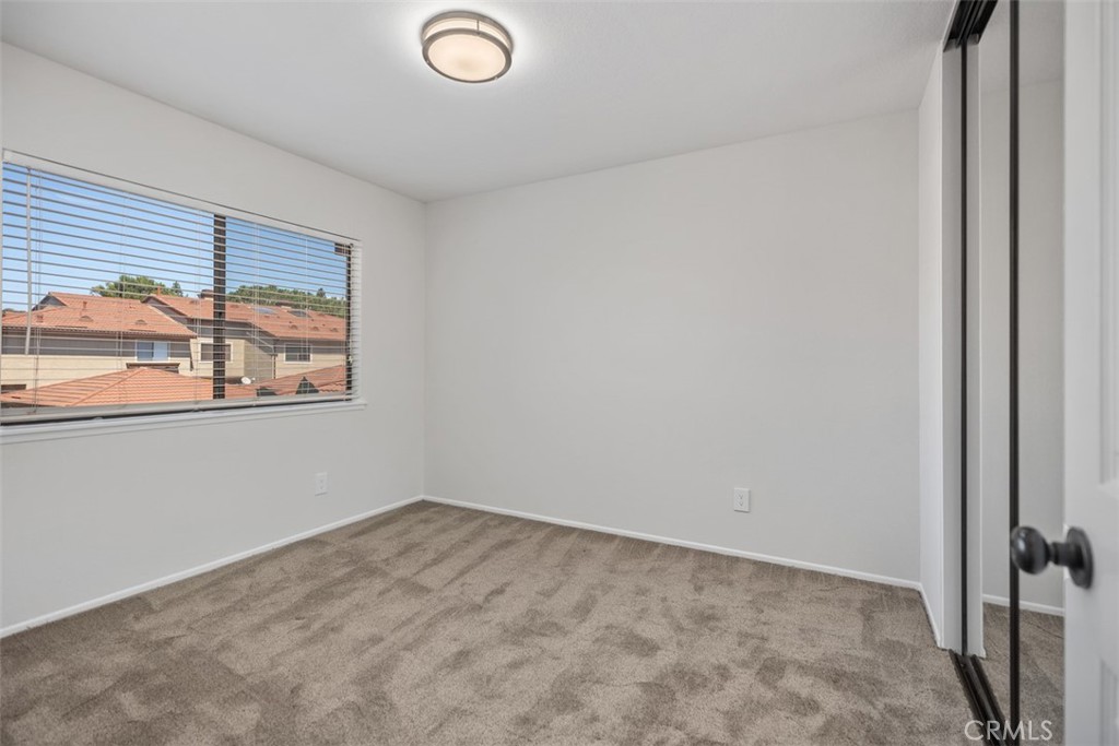 BR #2 of 4, with mirrored closet doors - 25716 Harbor Point Dr. 178, Dana Point CA 92629 - photo 17