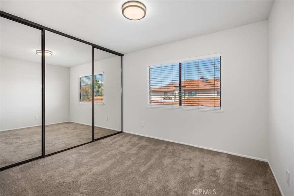 Bedroom #3 of 4 with mirrored closet doors - 25716 Harbor Point Dr. 178, Dana Point CA 92629 - photo 18