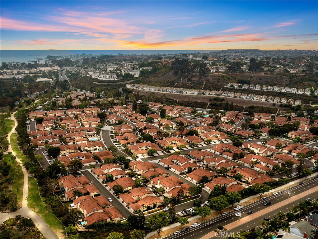 Sunset aerial: Sycamore Creek Trail winding to Doheny State Beach - 25742 Shell Drive 189, Dana Point CA 92629 - photo 2
