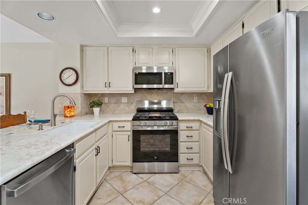 Stainless gas range and stone counters - 25742 Shell Drive 189, Dana Point CA 92629 - photo 15