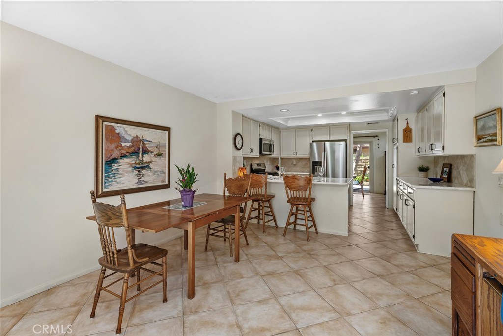 Breakfast nook/family room open to the kitchen - 25742 Shell Drive 189, Dana Point CA 92629 - photo 17