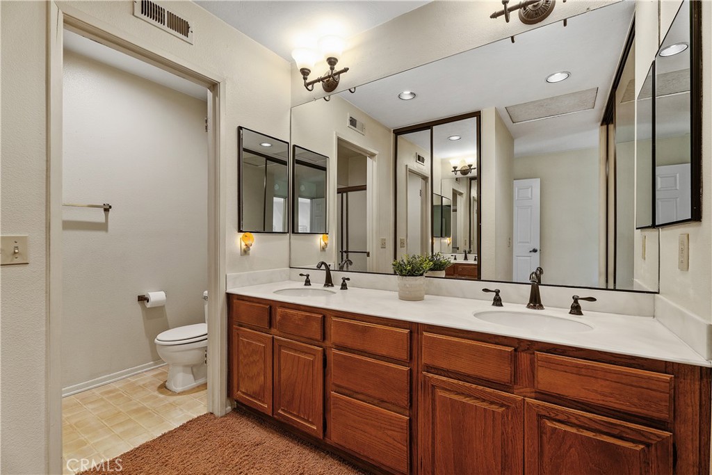 Primary ensuite bathroom with dual vanity - 25742 Shell Drive 189, Dana Point CA 92629 - photo 28