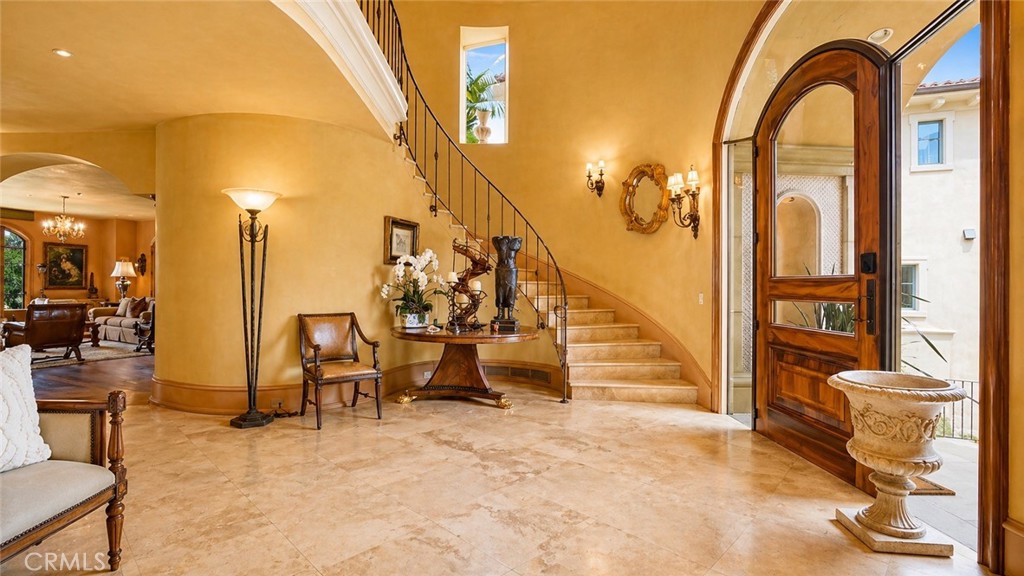 Two story Foyer with Large area open to second floor. Custom Front door of Solid Walnut and Glass. - 26 RITZ COVE, Dana Point CA 92629 - photo 6