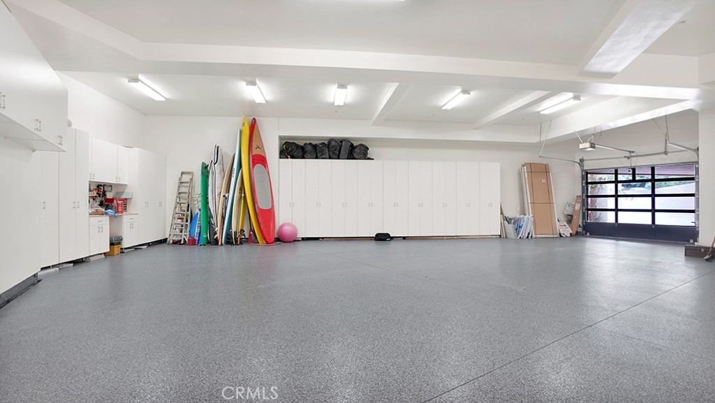 Garage easily holds 4-6 cars, subterranean. Lots of storage on three sides and high ceilings. - 26 RITZ COVE, Dana Point CA 92629 - photo 60