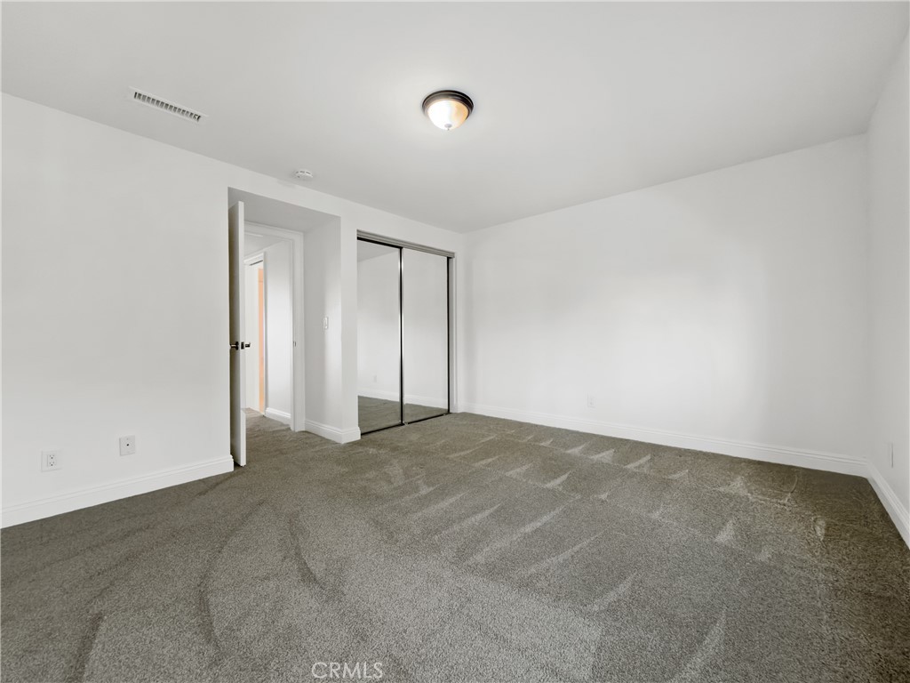 with a walk in closet as well as the double mirrored door closet - 26046 View Point E, Dana Point CA 92624 - photo 30