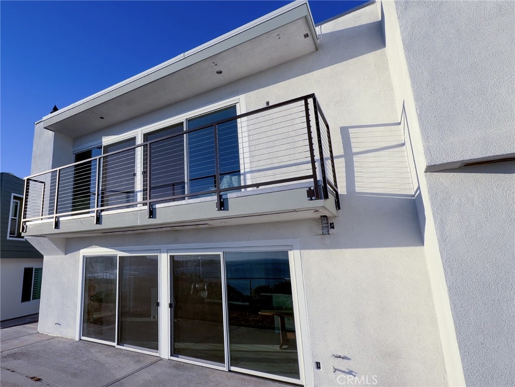 Completed rear exterior renovation featuring modern cable railings designed to enhance ocean-view enjoyment and contempo - 26046 View Point E, Dana Point CA 92624 - photo 42