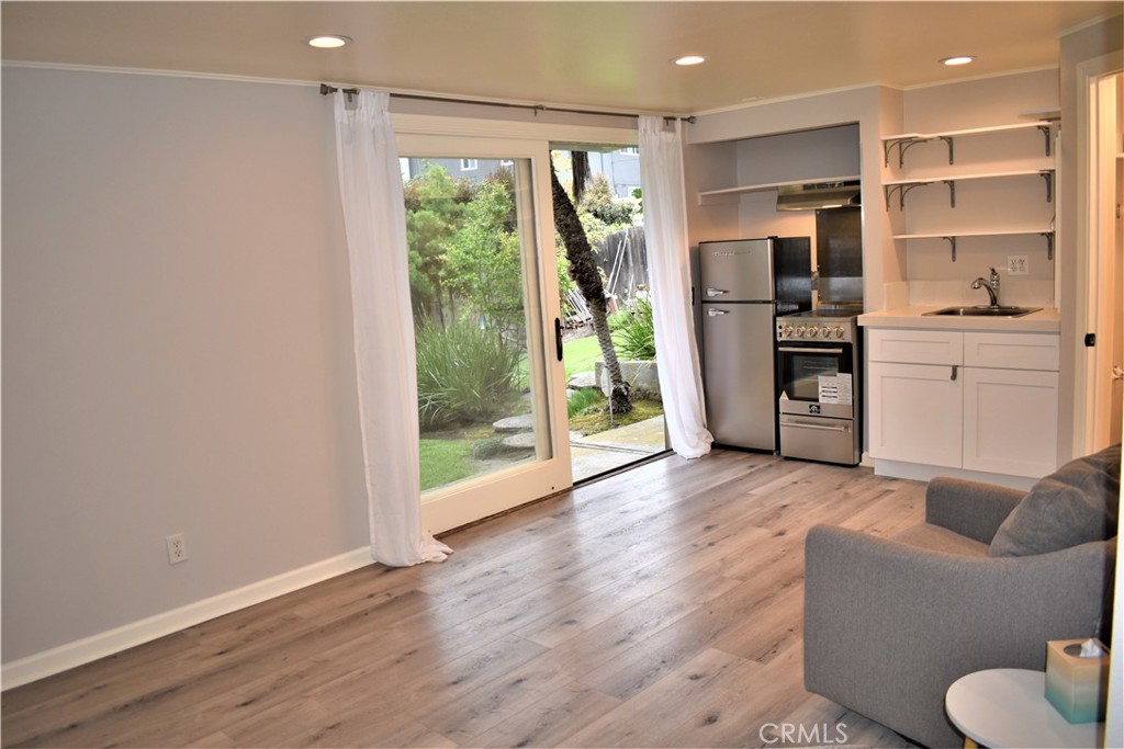 WELCOME HOME! Main living area looking towards the kitchen area and slider to rear yard. - 26853 Calle Verano, Dana Point CA 92624 - photo 1