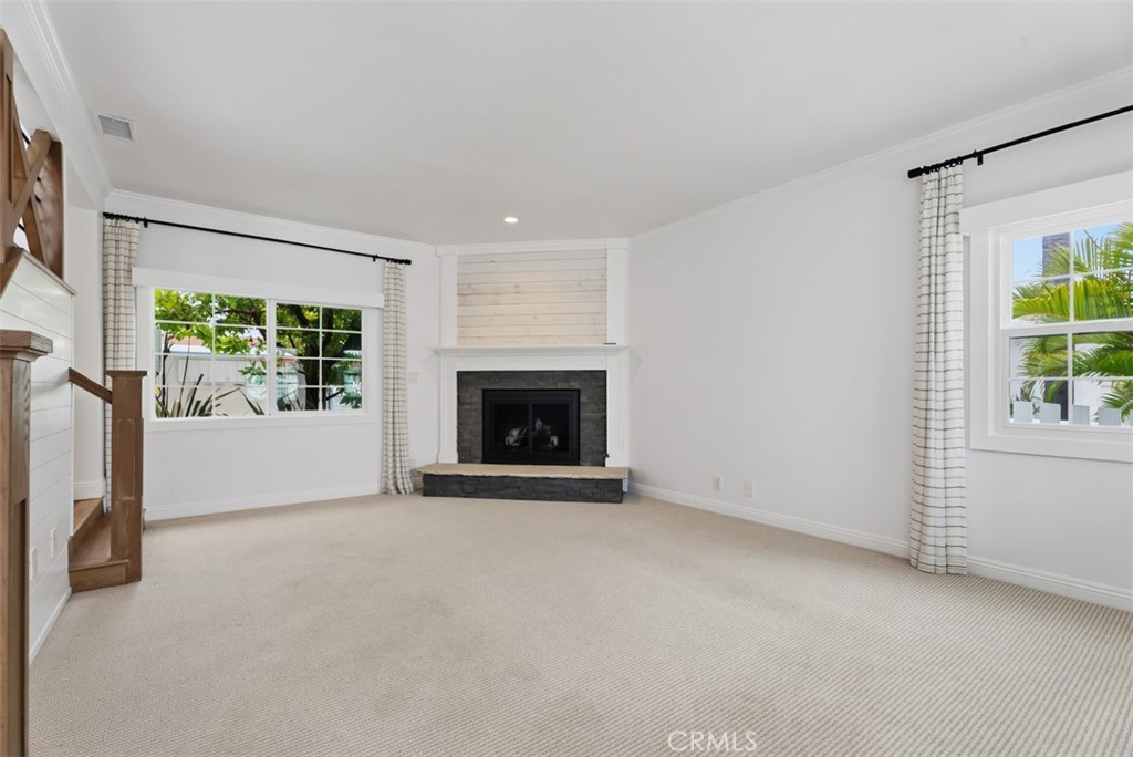 As you enter to the left is this great livingroom space with fireplace. - 26882 Calle Real, Dana Point CA 92624 - photo 3