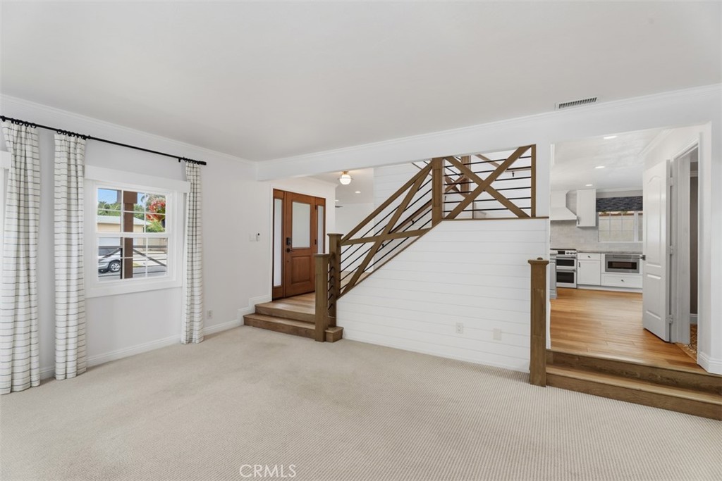 Front door from living room with stairway to 2nd floor - 26882 Calle Real, Dana Point CA 92624 - photo 5