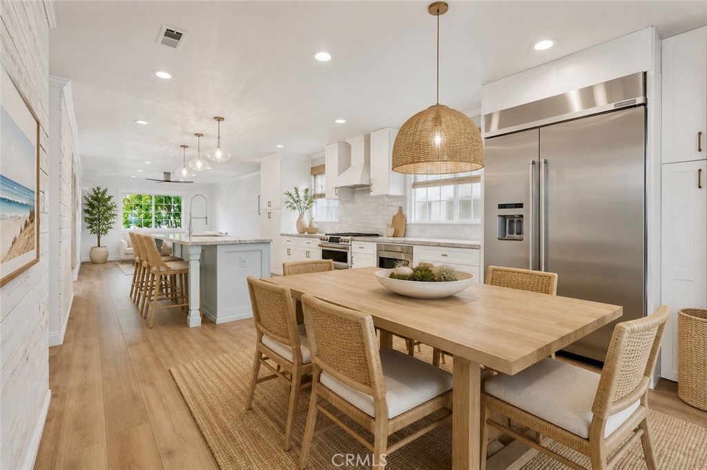 Kitchen has great dining area allowing for open concept living. AI Staged - 26882 Calle Real, Dana Point CA 92624 - photo 9