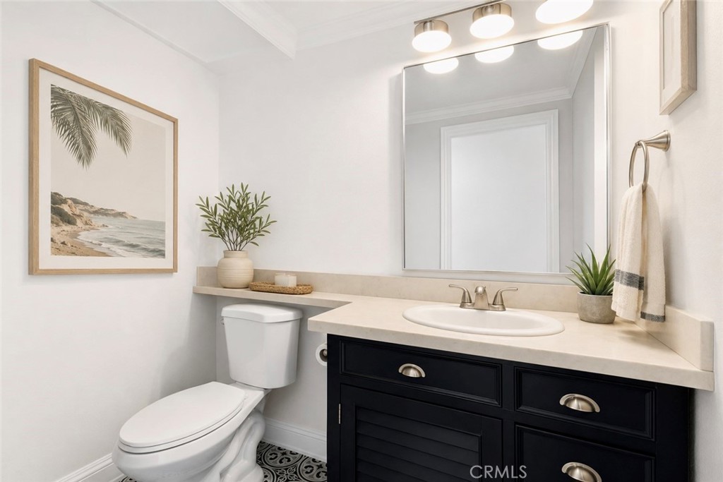 Downstairs 1/2 bath AI Staged - 26882 Calle Real, Dana Point CA 92624 - photo 20