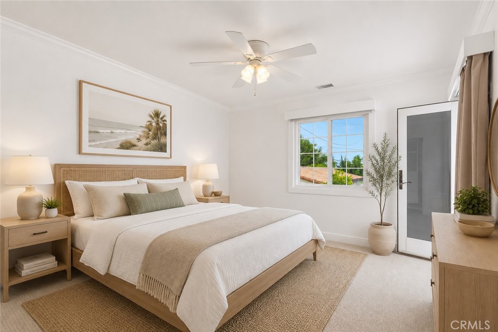Upstairs bedroom with balcony with a color change from pink to neutral colors. AI Staged - 26882 Calle Real, Dana Point CA 92624 - photo 28