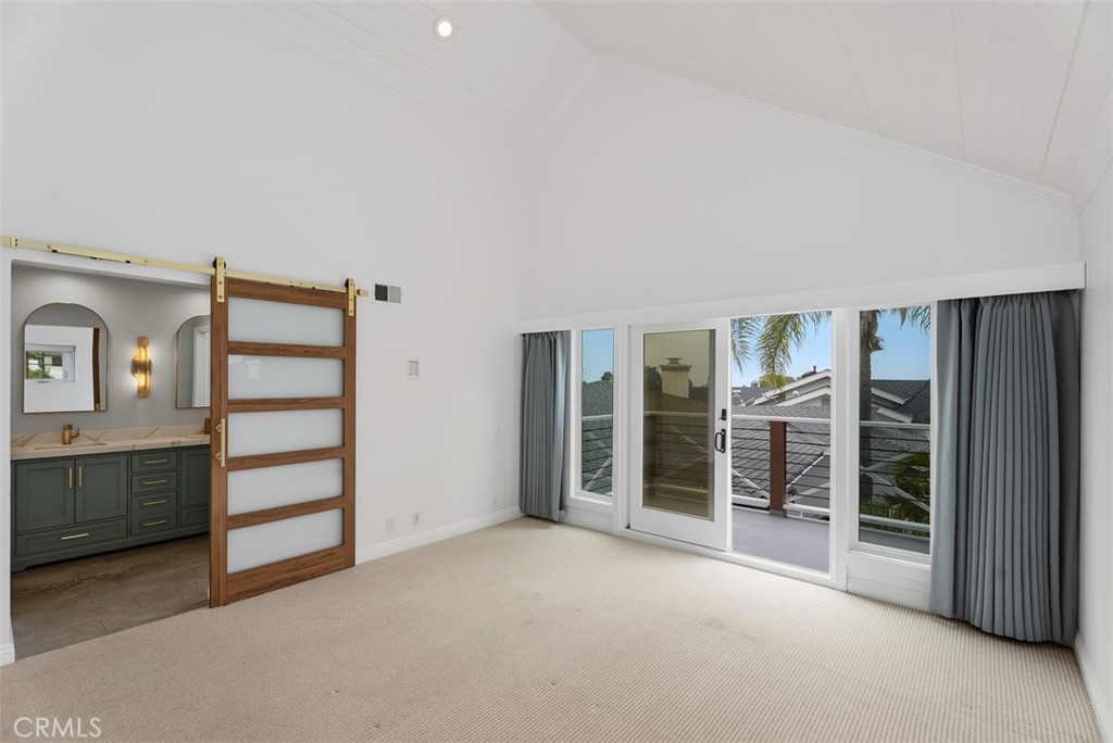 Primary Bedroom with balcony, peek-a-boo ocean views and wonderful ocean breezes. - 26882 Calle Real, Dana Point CA 92624 - photo 30