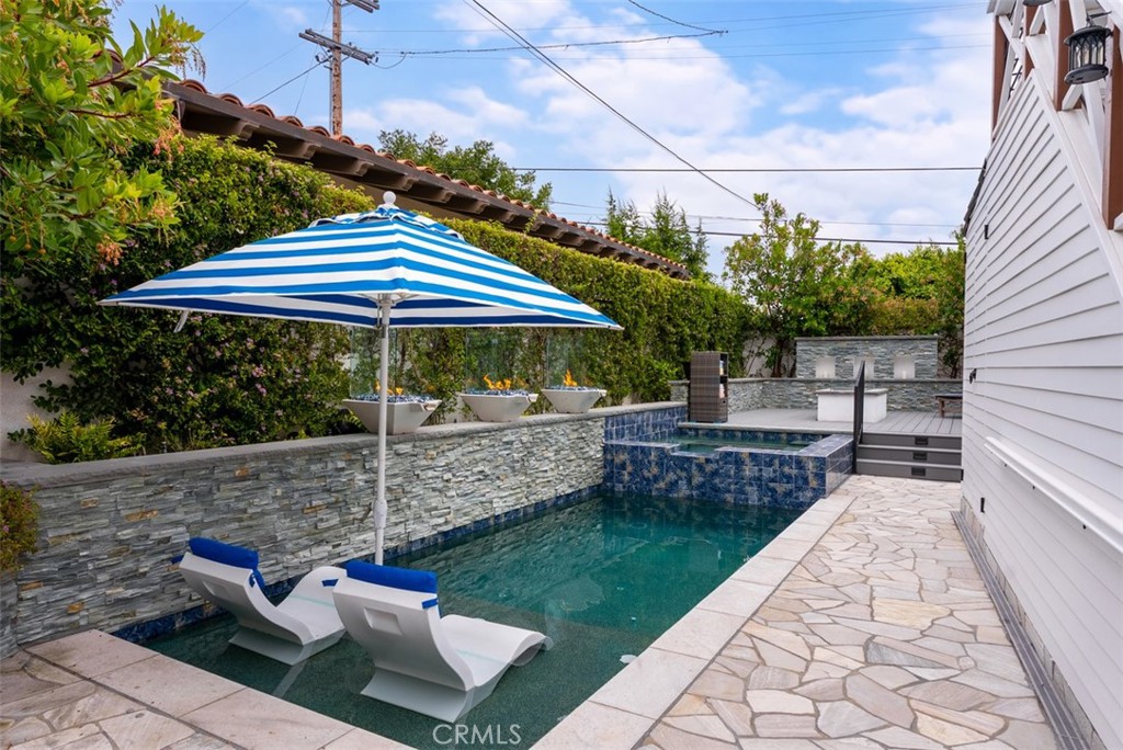 Saltwater pool with Baja shelf , 3 spillover water/fire bowls and salt water spa with pillover all control by phone app - 26882 Calle Real, Dana Point CA 92624 - photo 42