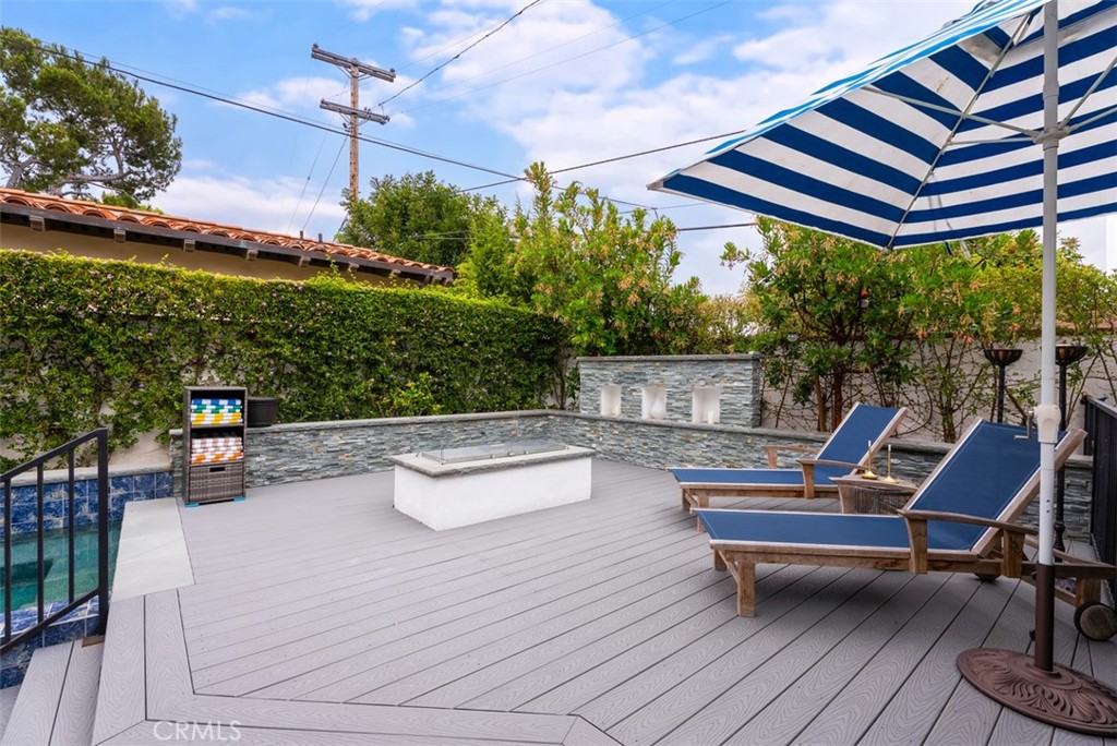 Upper deck with sitting area features built in decorative reflective fireglass matching the 3 pool spillovers accents, v - 26882 Calle Real, Dana Point CA 92624 - photo 44
