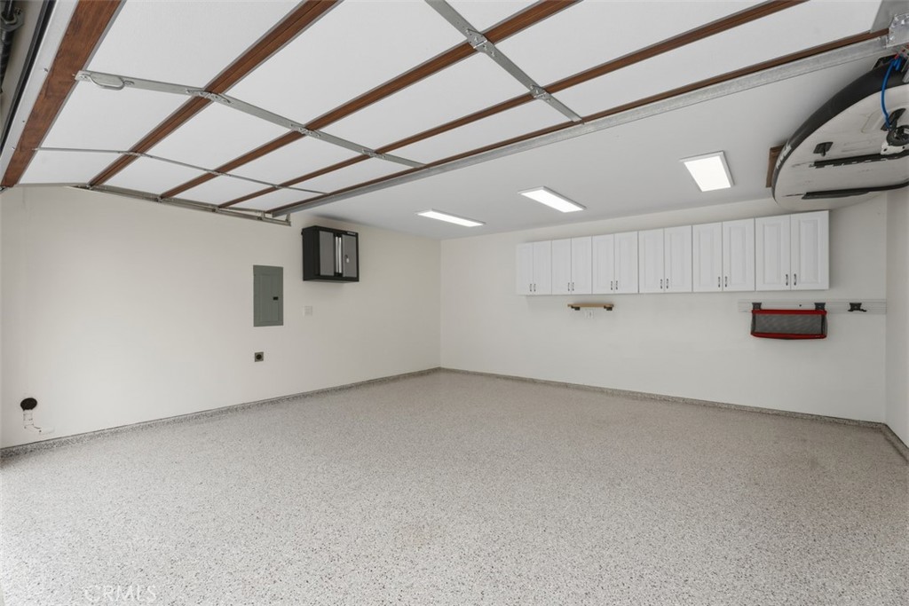 Epoxy Coated two car garage with storage. Property has 2 EV chargers. Garage is remote controlled finished completely an - 26882 Calle Real, Dana Point CA 92624 - photo 46
