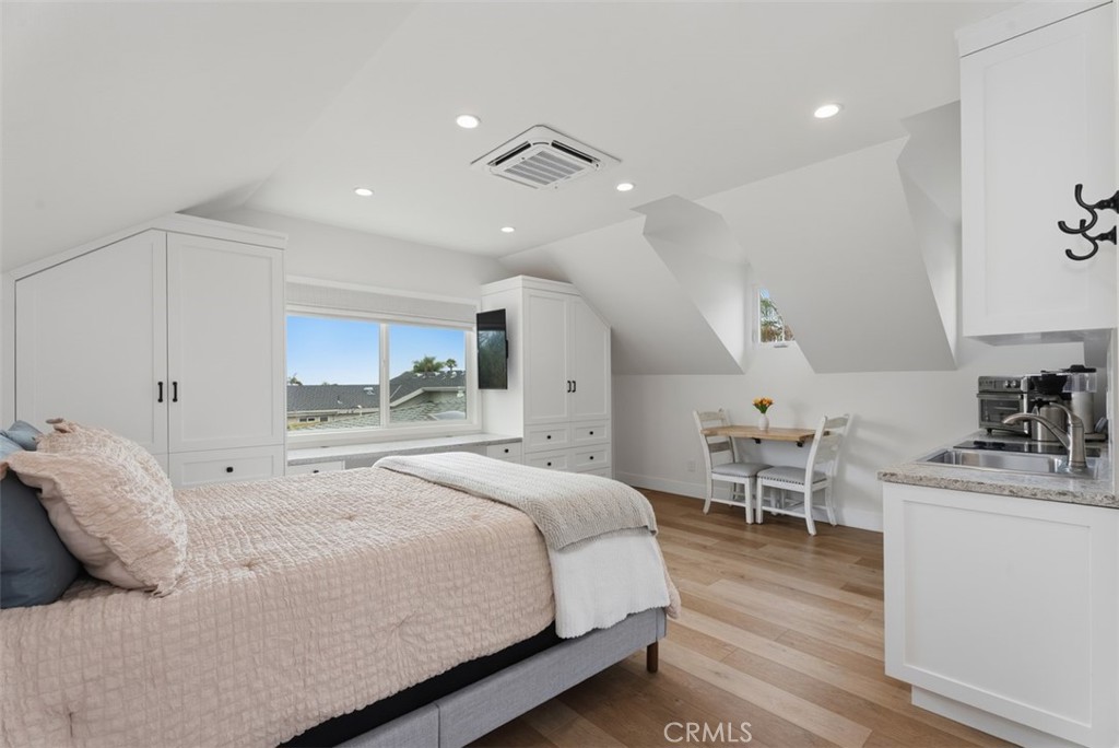 ADU above garage, wall to wall storage behind hidden custom cabinets, window with ocean views, mounted tv, two built-in - 26882 Calle Real, Dana Point CA 92624 - photo 47