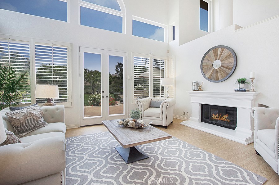 Living room with voluminous ceilings and windows viewing to the gorgeous back yard. - 27 Tirremia Drive, Dana Point CA 92629 - photo 1