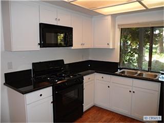 Newly updated kitchen with new cabinets and granite counters - 27061 MILL POND Road 40, Dana Point CA 92624 - photo 1