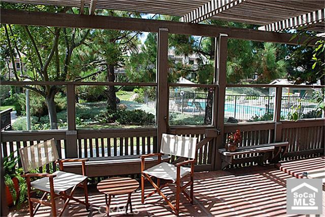 Patio with geenbelt and swimming pool views - 27095 MILL POND Road 47, Dana Point CA 92624 - photo 1